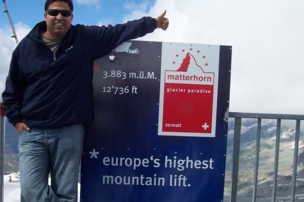 Gagan beside a Matterhorn Glacier Paradise lift sign