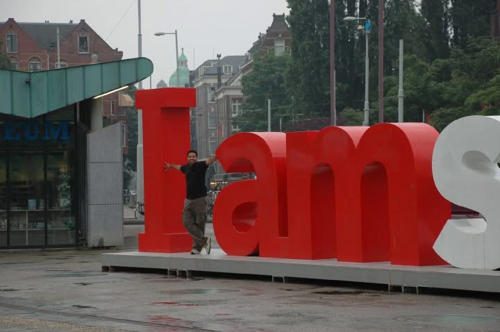 Gagan standing inside the I amsterdam sign