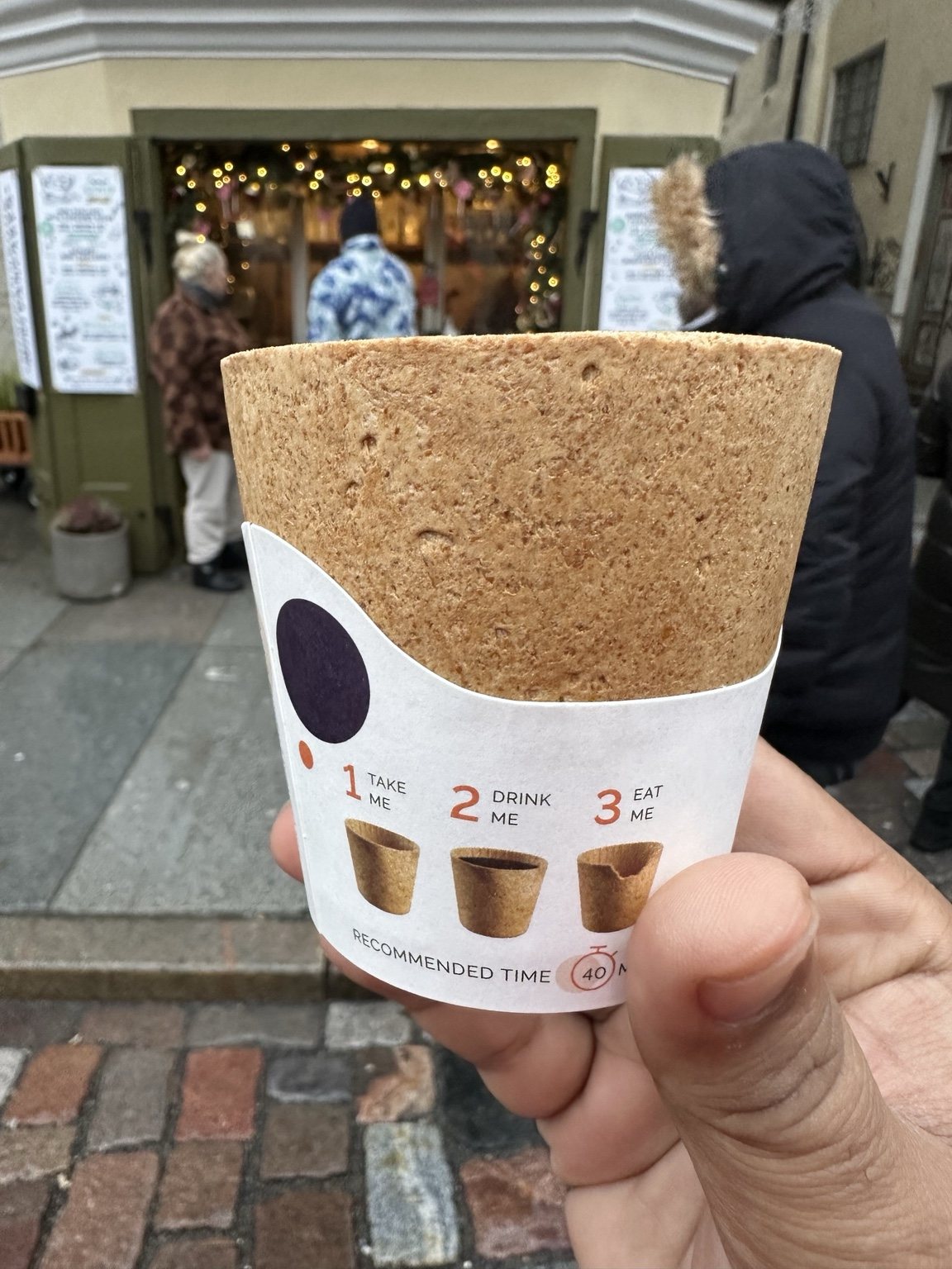Hot drink held at a winter market
