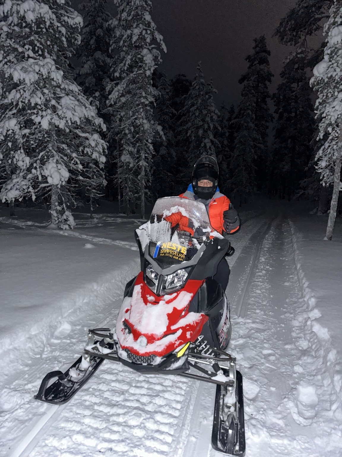Snowmobile trip through Finland at night