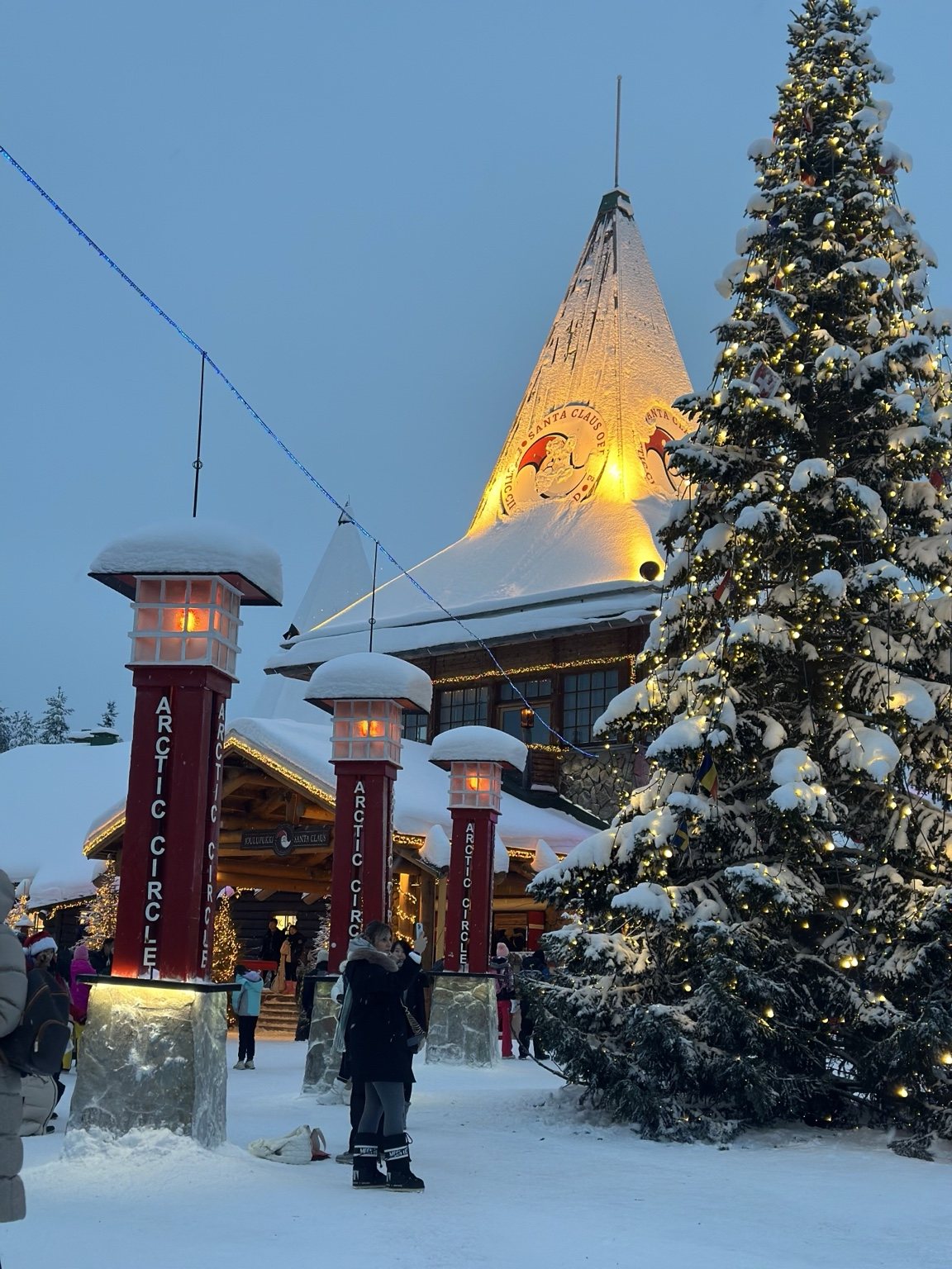 Illuminated Arctic Circle building and Christmas tree