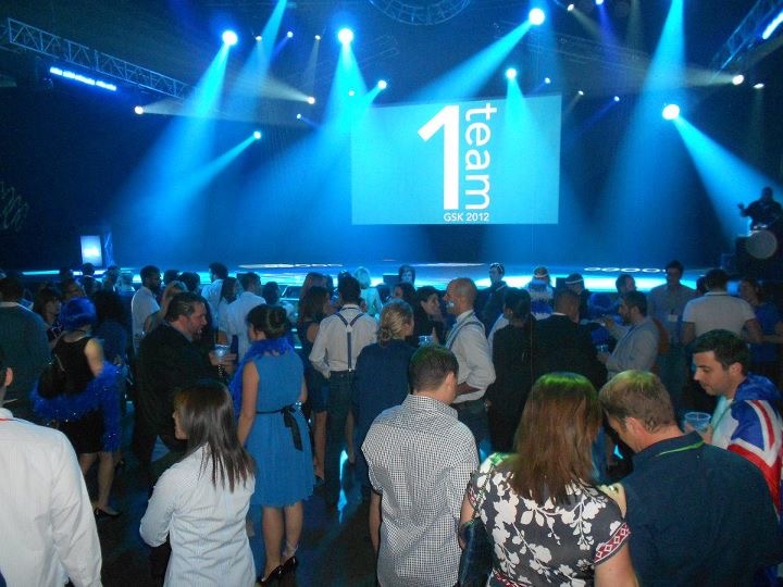 Colleagues gathered in front of the offsite stage
