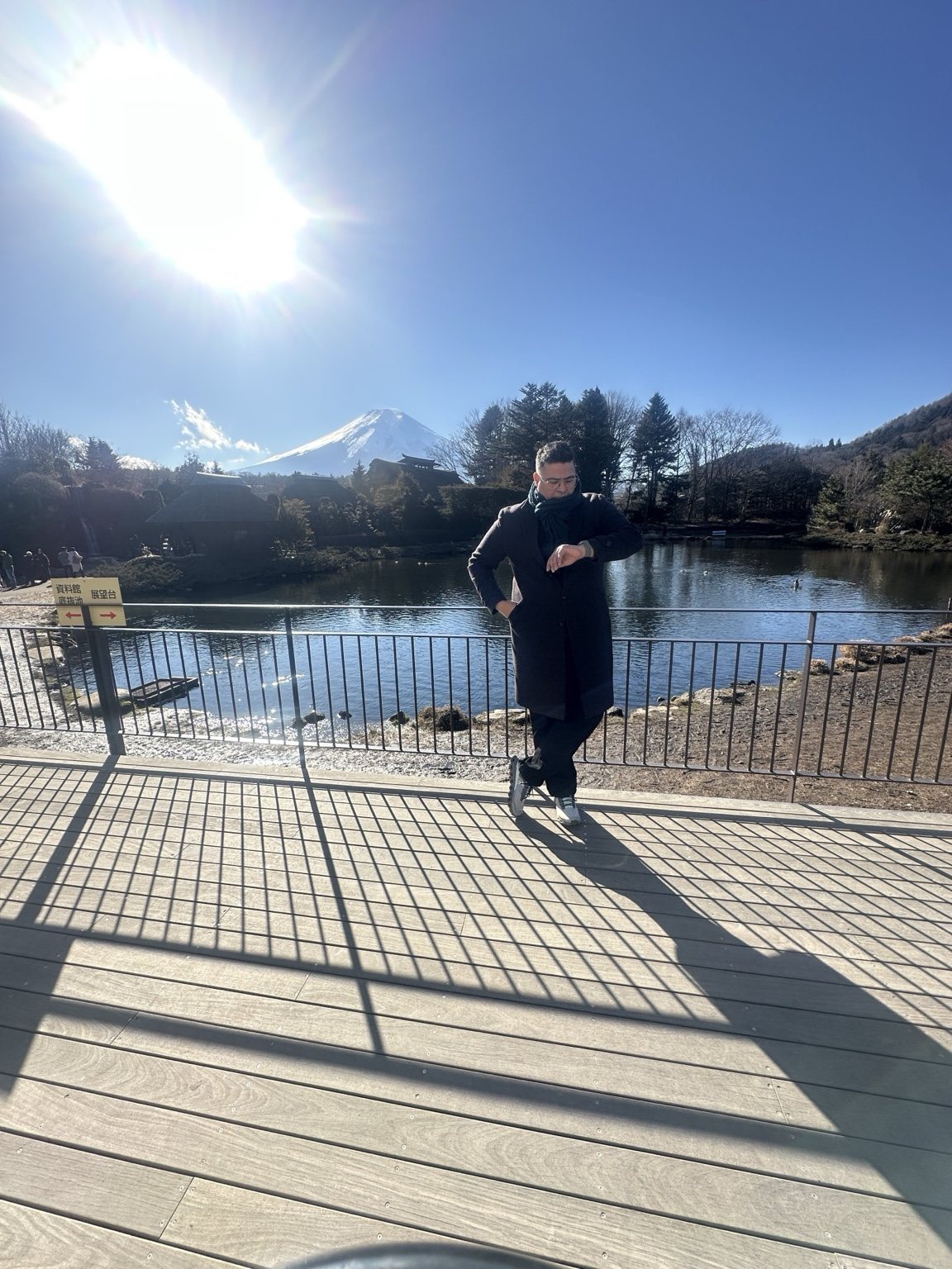 Traveler beside a lake with Mount Fuji in the distance