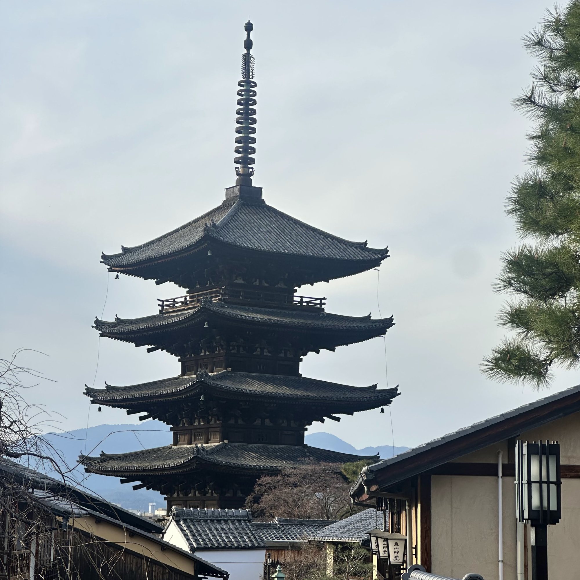 Pagoda rising over traditional rooftops