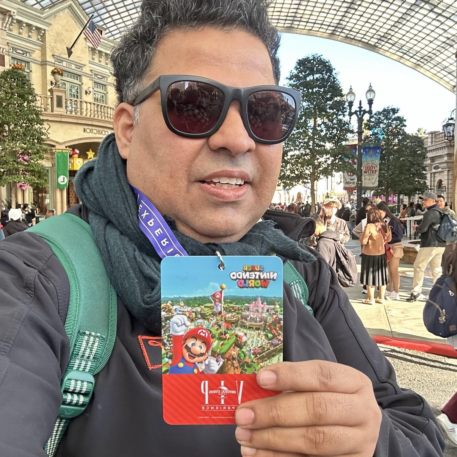 Gagan holding a themed snack at an amusement park