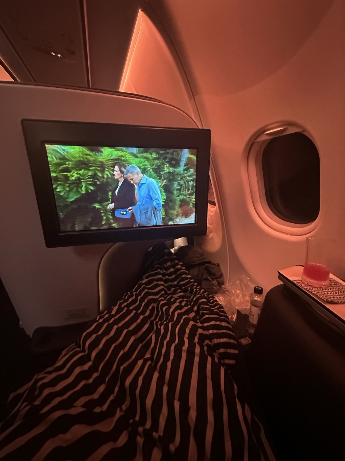 Reclining aircraft seat and in-flight screen on the way to Morocco