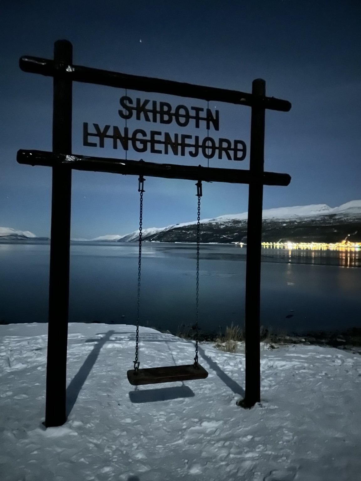 Skibotn Lyngenfjord sign beside the water